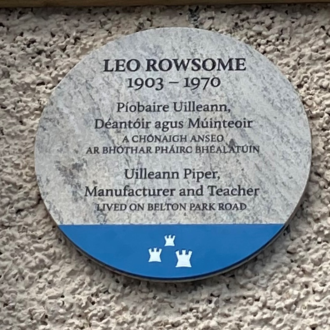 Photograph of commemorative plaque to Leo Rowsome, piper