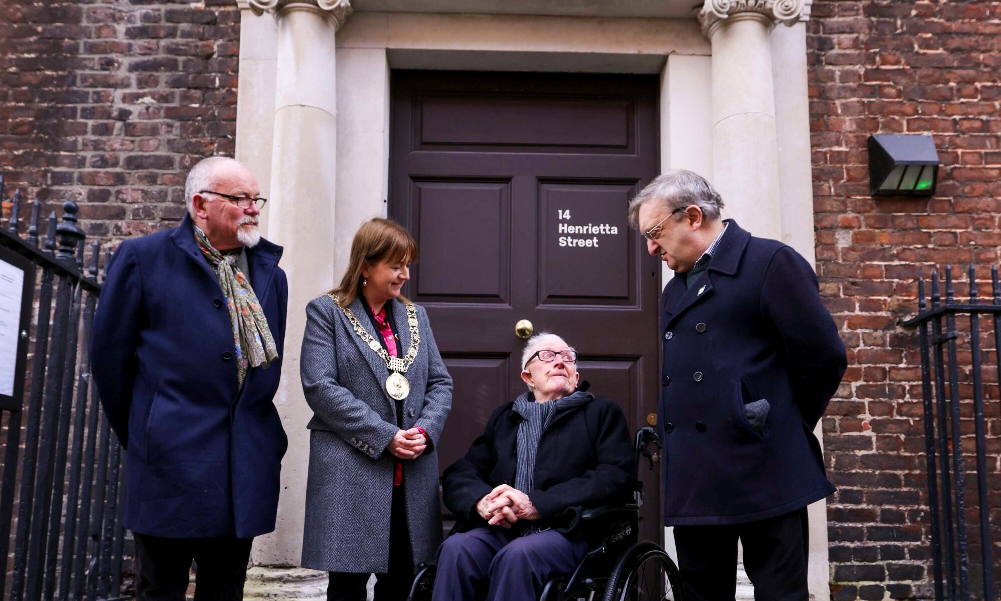 Photograph taken at 14 Henrietta Street, showing Fergus Whelan, Lord Mayor Caroline Conroy, Jimmy Phillips (nephew of Thomas Bryan), and Councillor Micheál Mac Donncha.